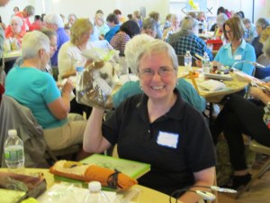 Gwen proudly displays her door prize!