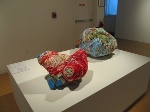 Two of Judith Scott's yarn sculptures!